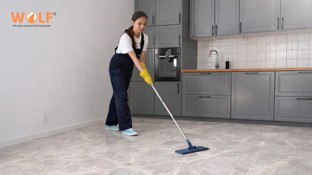 woman mopping porcelain kitchen floor with ease- clean matte finish in modern Guatemala home