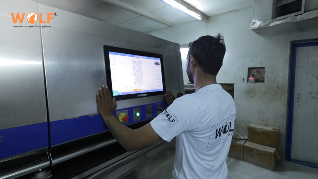 Wolf Group India technician operating Italian technology tile manufacturing equipment for Guatemala kitchen tiles.