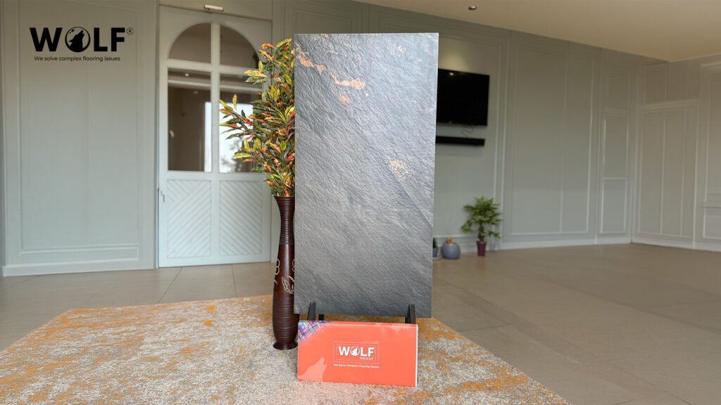 Large-format slate-finish porcelain tile sample displayed for quality inspection before ordering