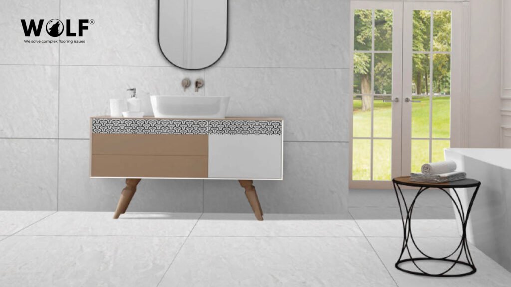 Grey marble-look porcelain wall tile and white floor tile in a modern bathroom