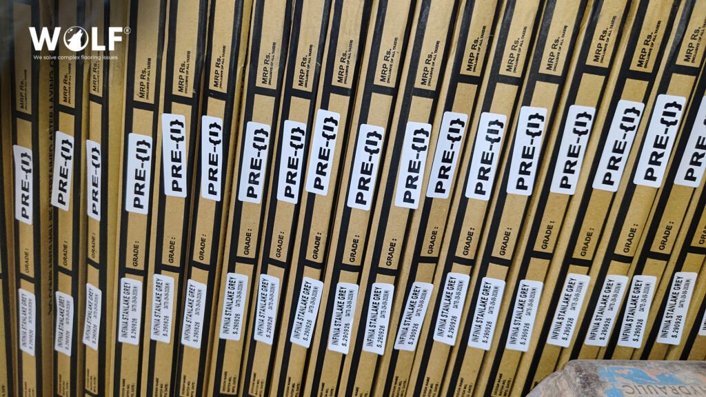 Cartons of grey porcelain tile with design, batch and grade labels on every box, ready for a first export order