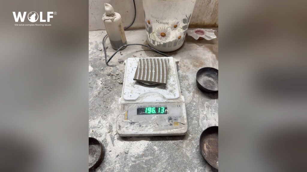 Porcelain tile sample on a laboratory scale during quality testing at Wolf’s Morbi factory